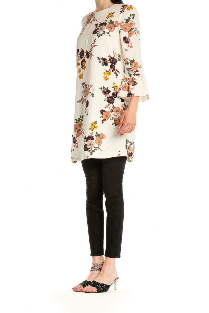 Front view of Sanctuary cream floral mini dress with bell sleeves