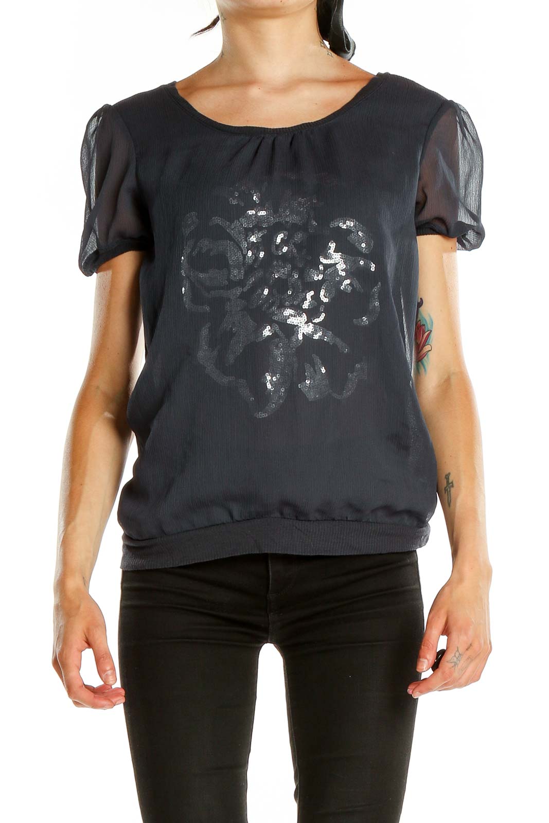 Front view of Cynthia Rowley black top with silver floral print and sheer sleeves