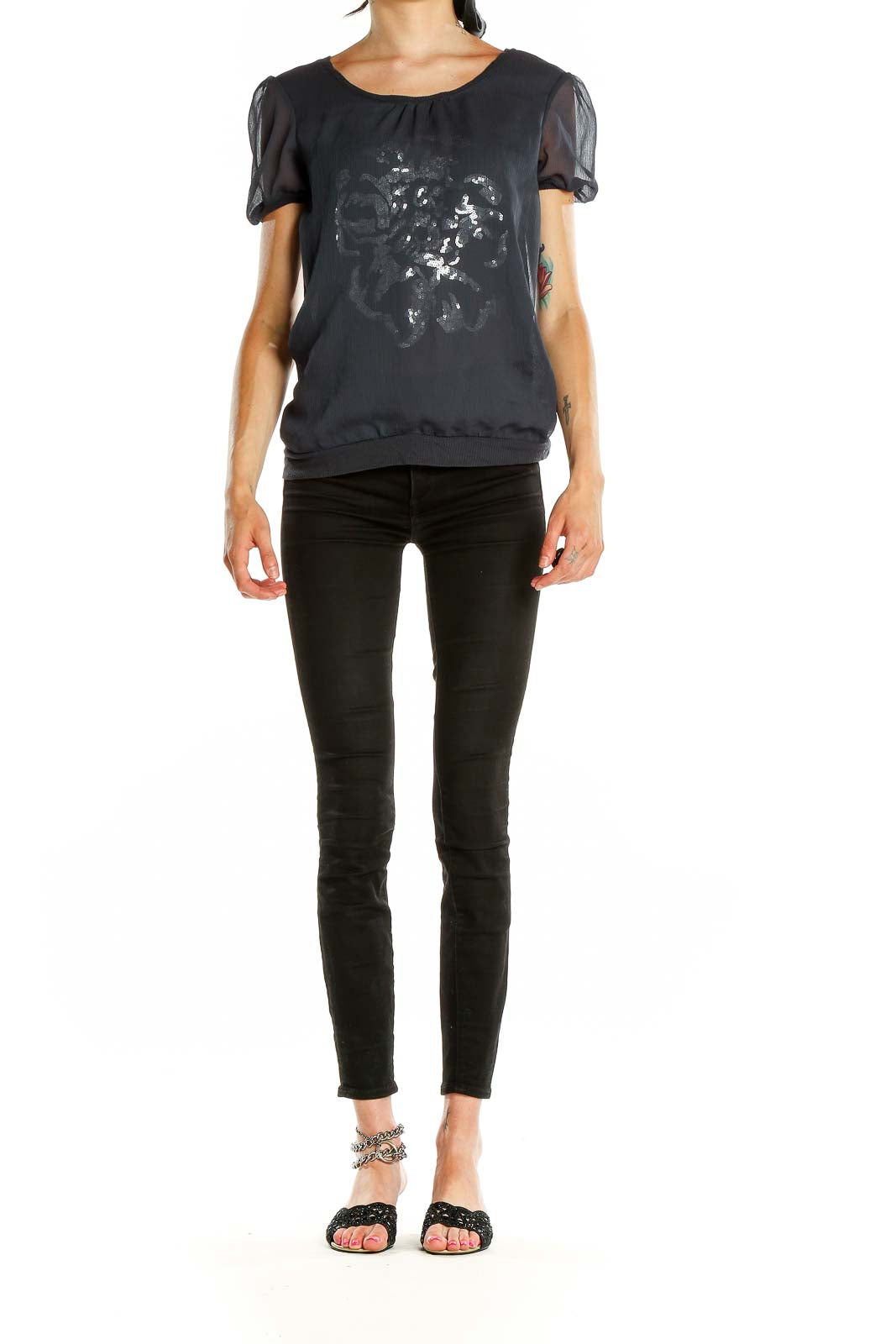 Front view of Cynthia Rowley black top with silver floral print and sheer sleeves
