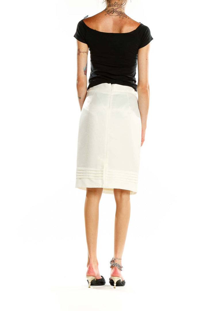 Back view of white Tex by MaxAzria pencil skirt showing sleek silhouette