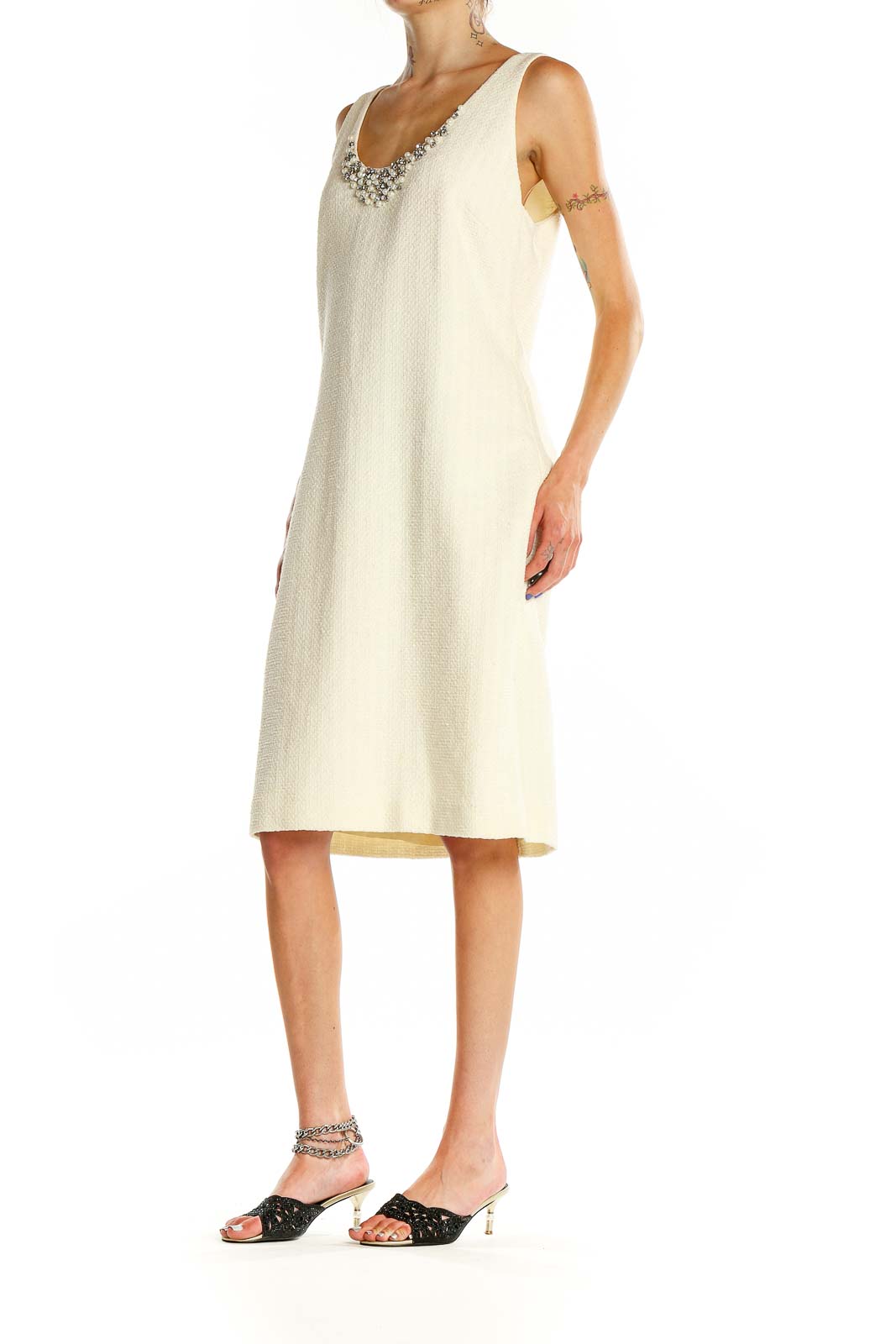 Front view of Magaschoni Collection cream sheath dress with embellished neckline