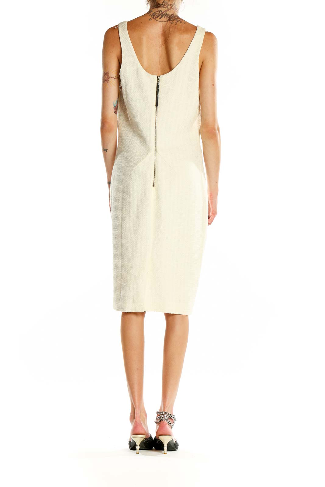 Back view of Magaschoni Collection cream sheath dress showing zipper closure