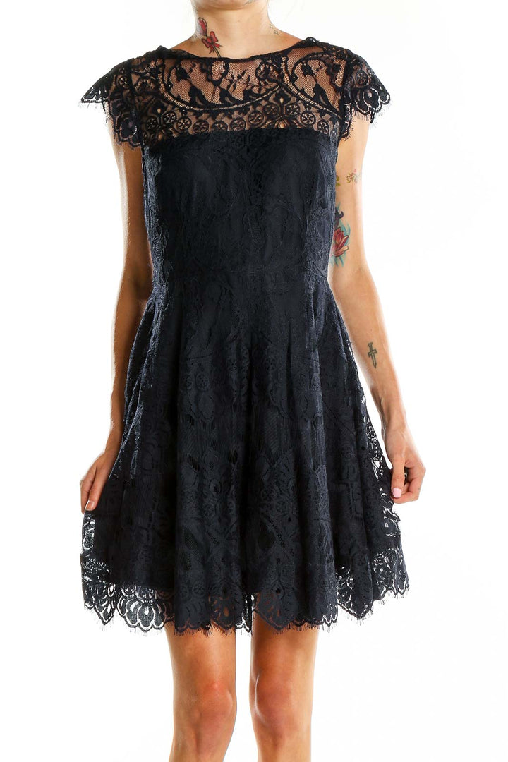 Front view of BB Dakota black lace cocktail dress with sheer neckline