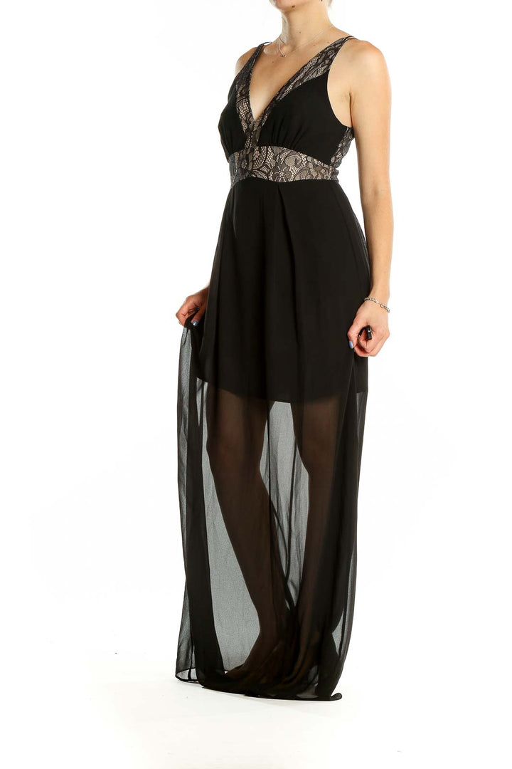 Front view of BCBGeneration black maxi dress with lace-trimmed plunging neckline and sheer overlay
