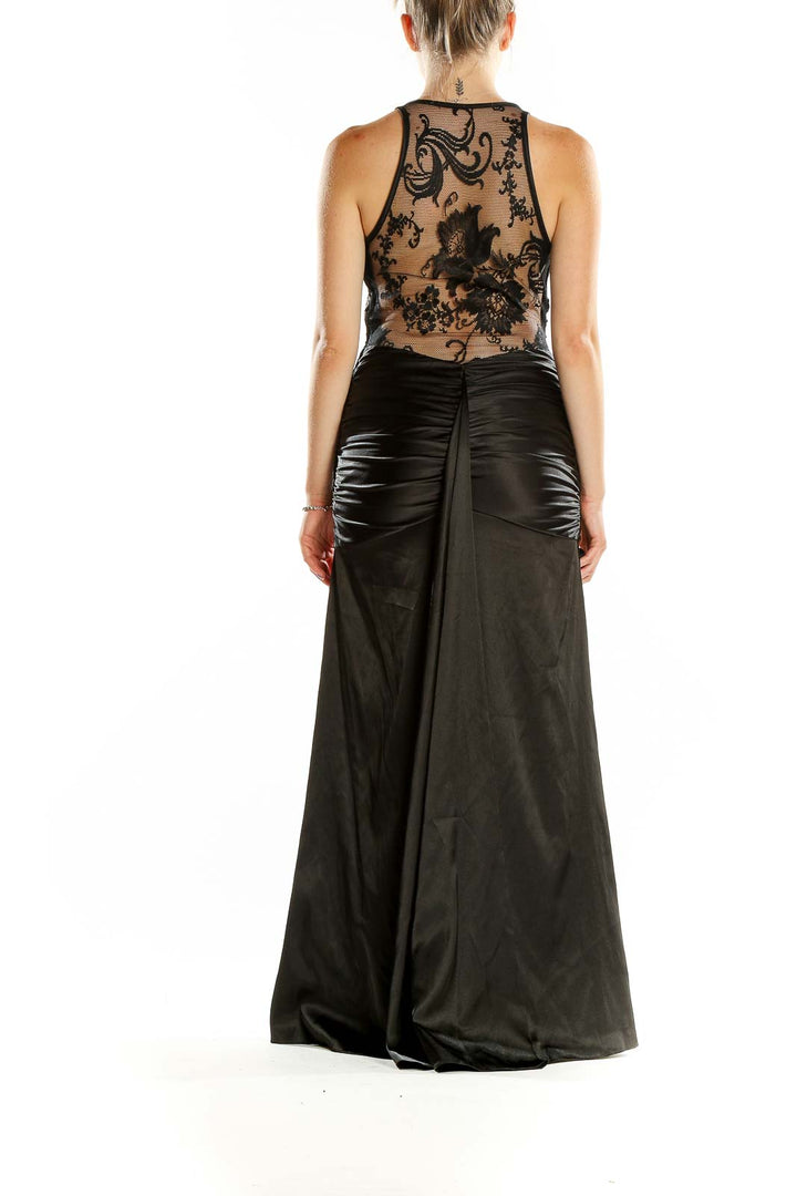Back view of black mermaid evening gown with sheer embroidered panel by Jessica McClintock