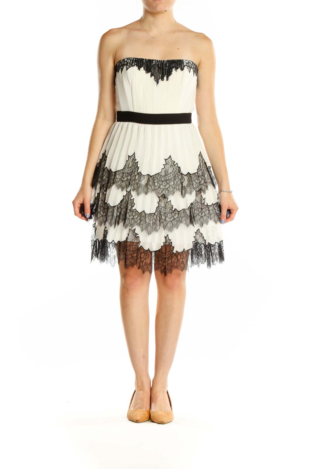 Front view of BCBG MaxAzria white lace strapless cocktail dress with black trim and tiered skirt