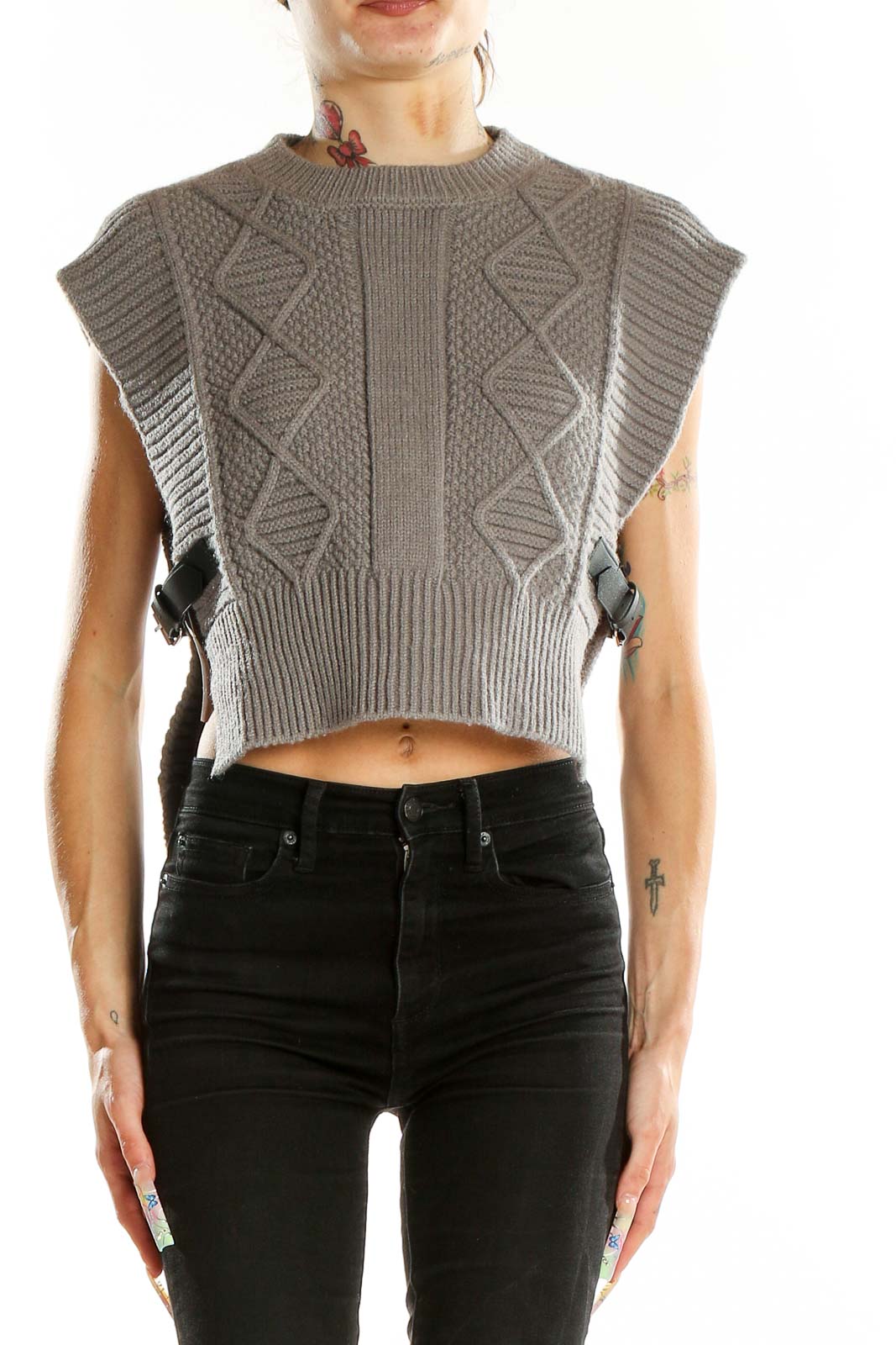 Front view of gray cropped cable knit sweater vest with side buckles