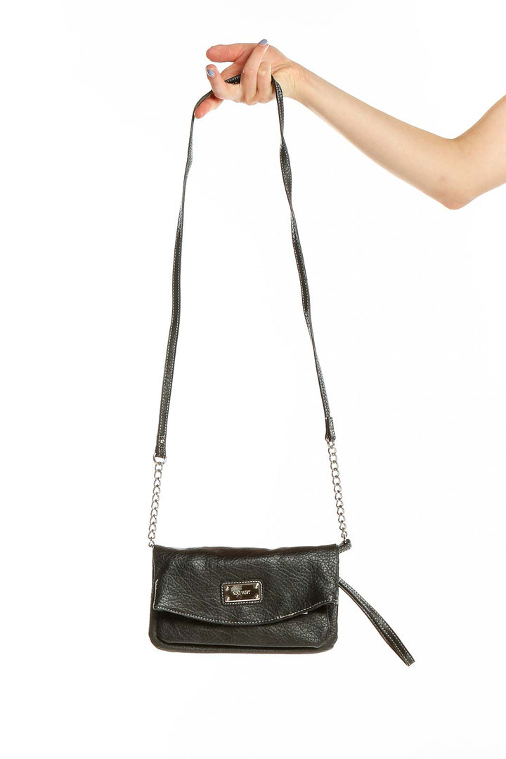 Front view of Nine West black leather crossbody bag with silver hardware