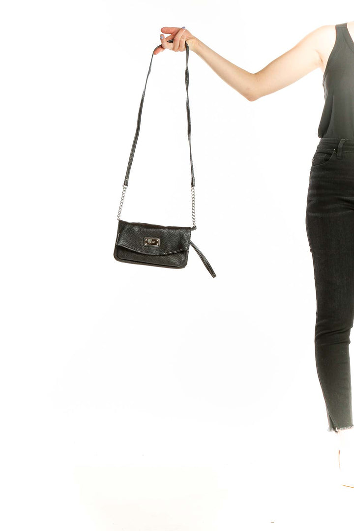 Front view of Nine West black leather crossbody bag with silver hardware