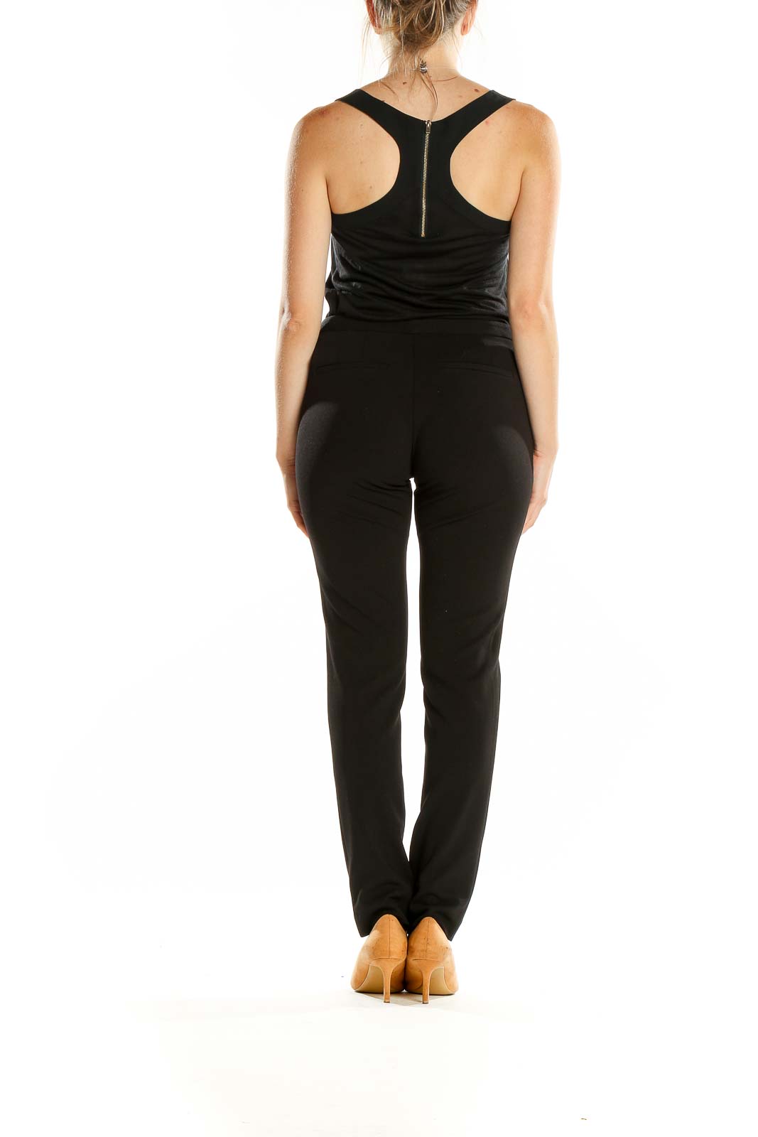 Back view of Calvin Klein black straight-leg pants on model