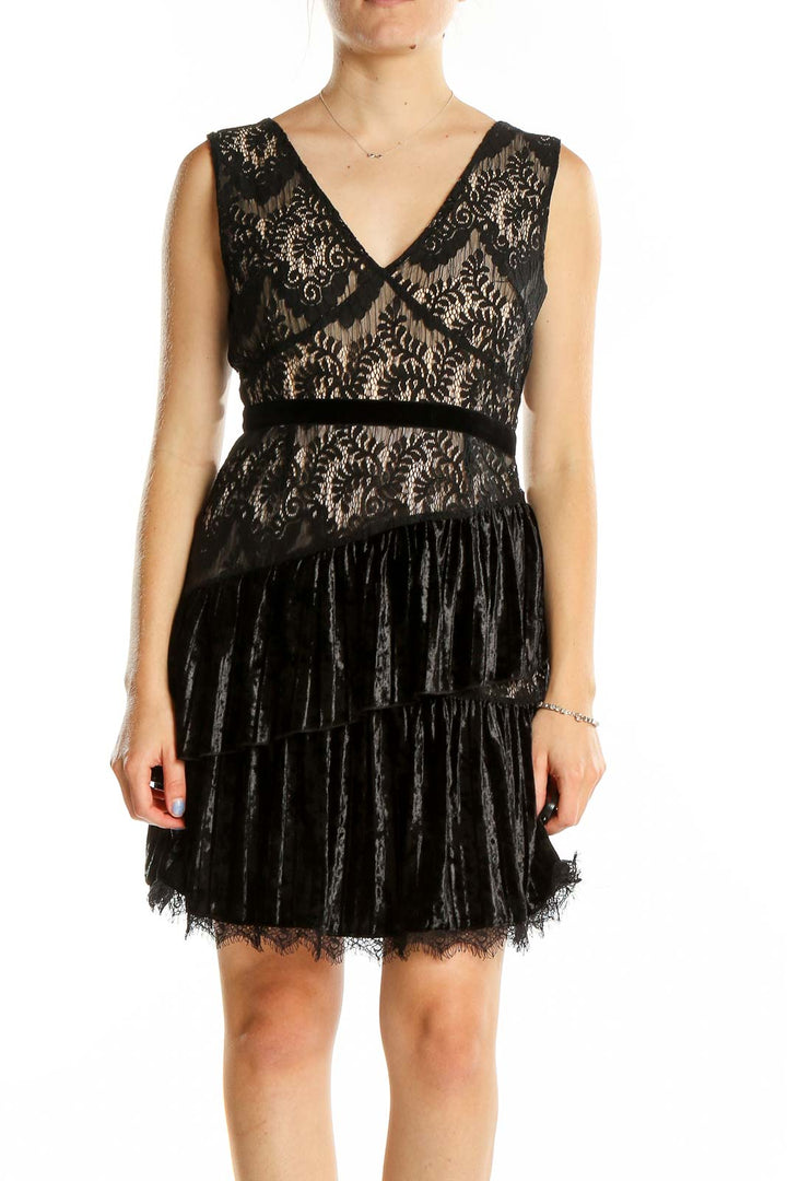 Front view of Foxiedox black lace and velvet mini dress with V-neckline and tiered skirt
