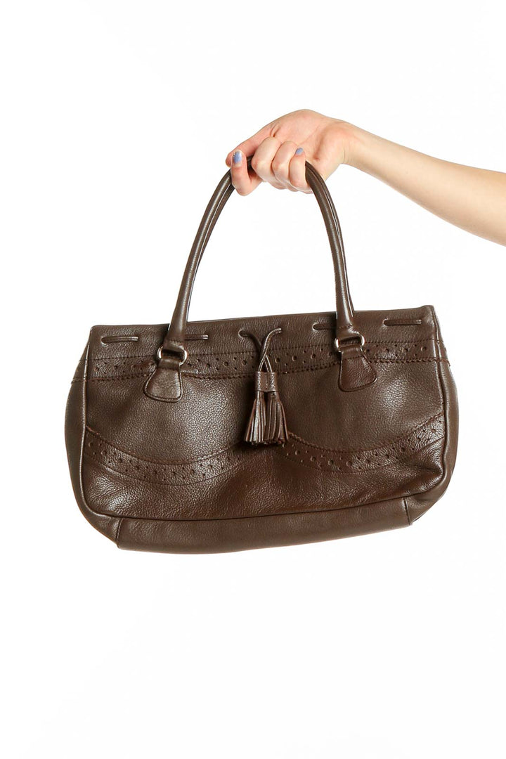 Front view of Maxx New York brown leather shoulder bag with tassel