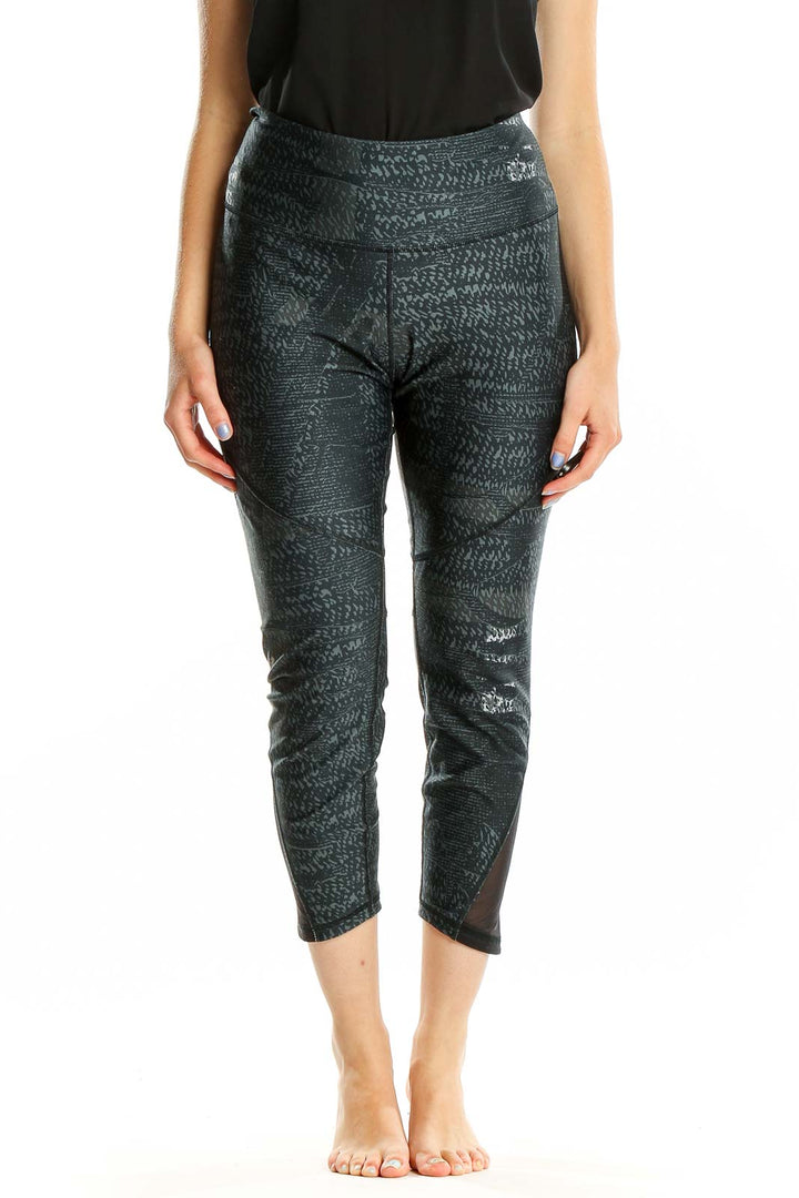 Front view of Under Armour black patterned capri leggings with high waist