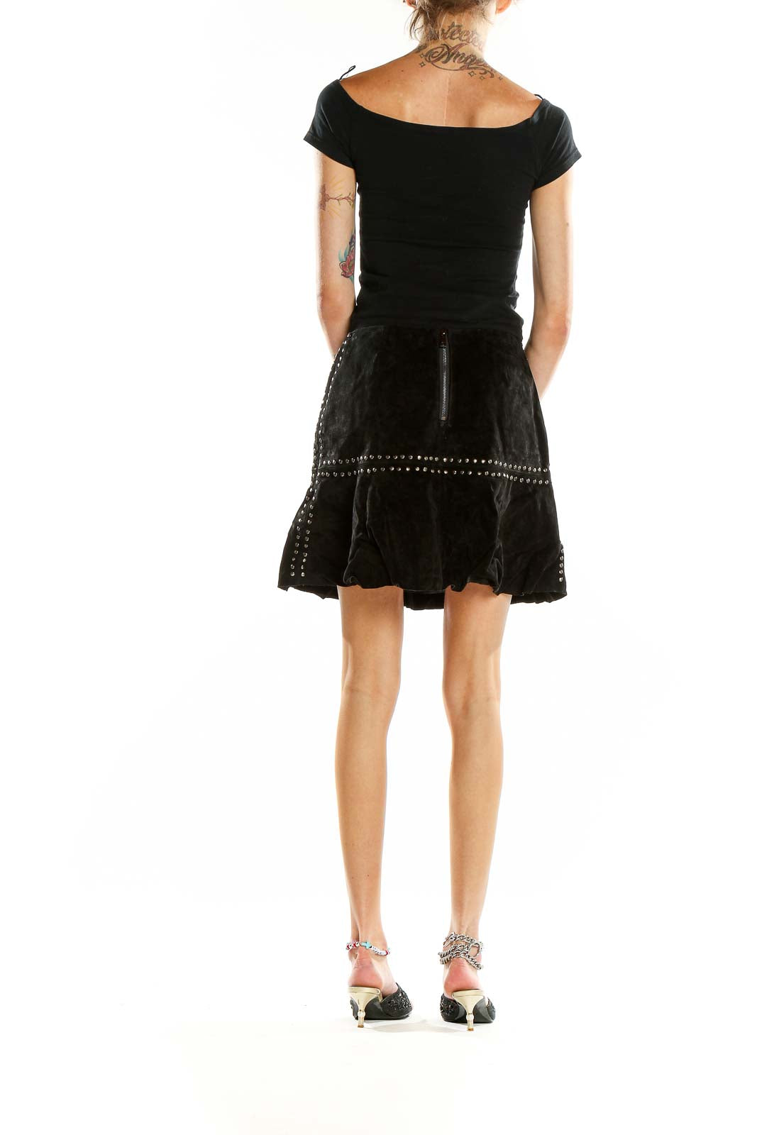 Back view of Willow & Clay black leather studded mini skirt with zipper closure