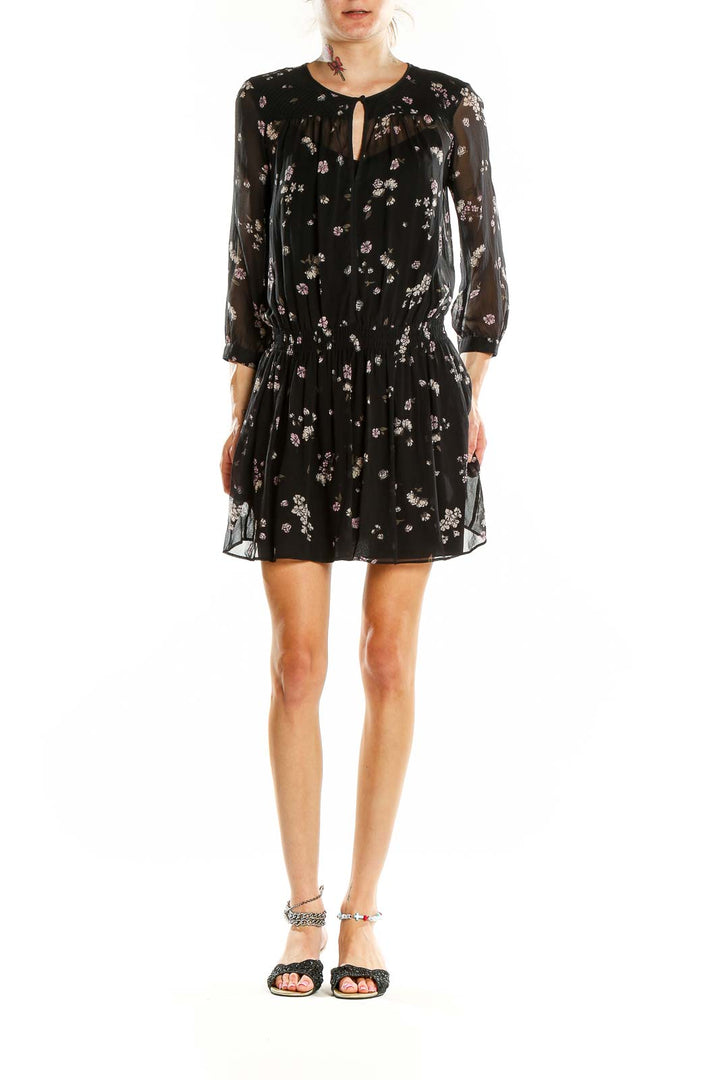Front view of Club Monaco black floral sheer mini dress with keyhole neckline