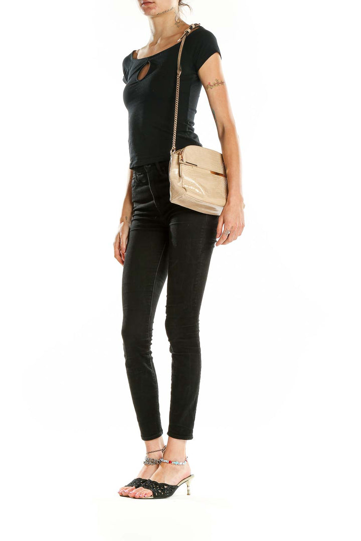 Front view of beige croc-embossed crossbody bag with gold-tone accent