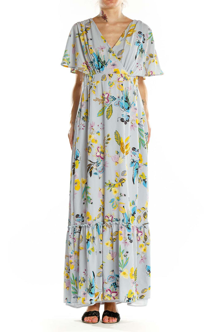 Front view of Slate & Willow light blue floral maxi wrap dress with flutter sleeves