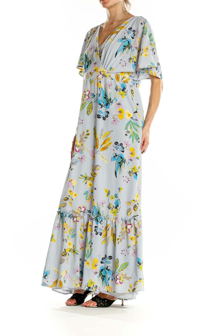 Front view of Slate & Willow light blue floral maxi wrap dress with flutter sleeves