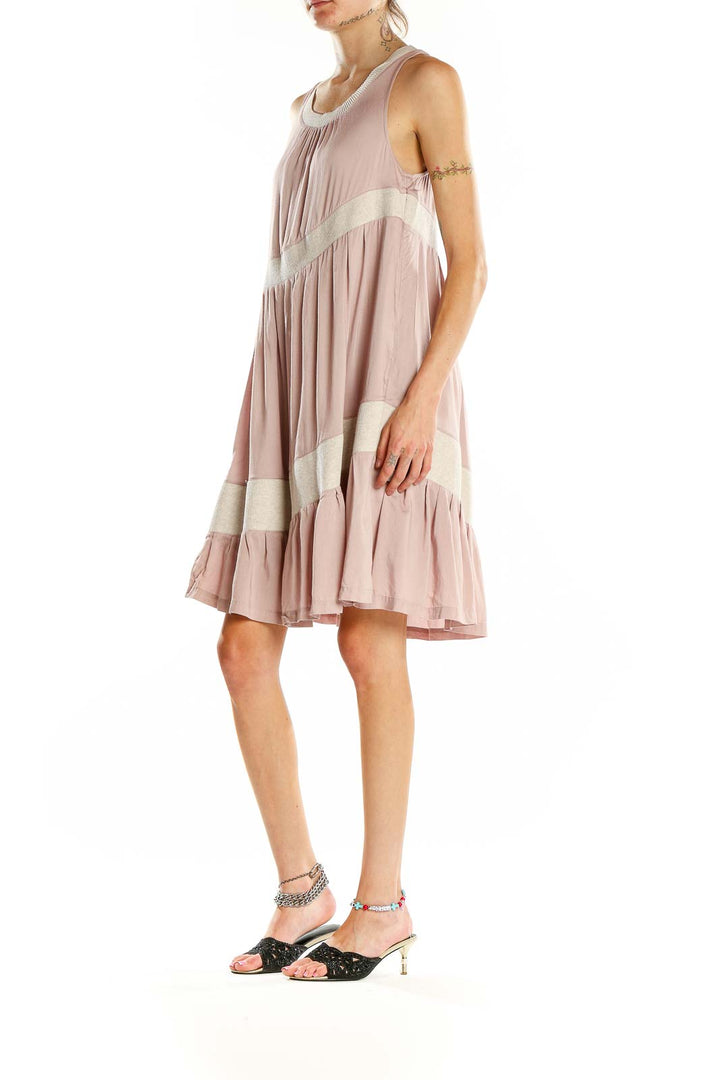 Front view of blush Maeve tiered sleeveless midi dress with cream trim