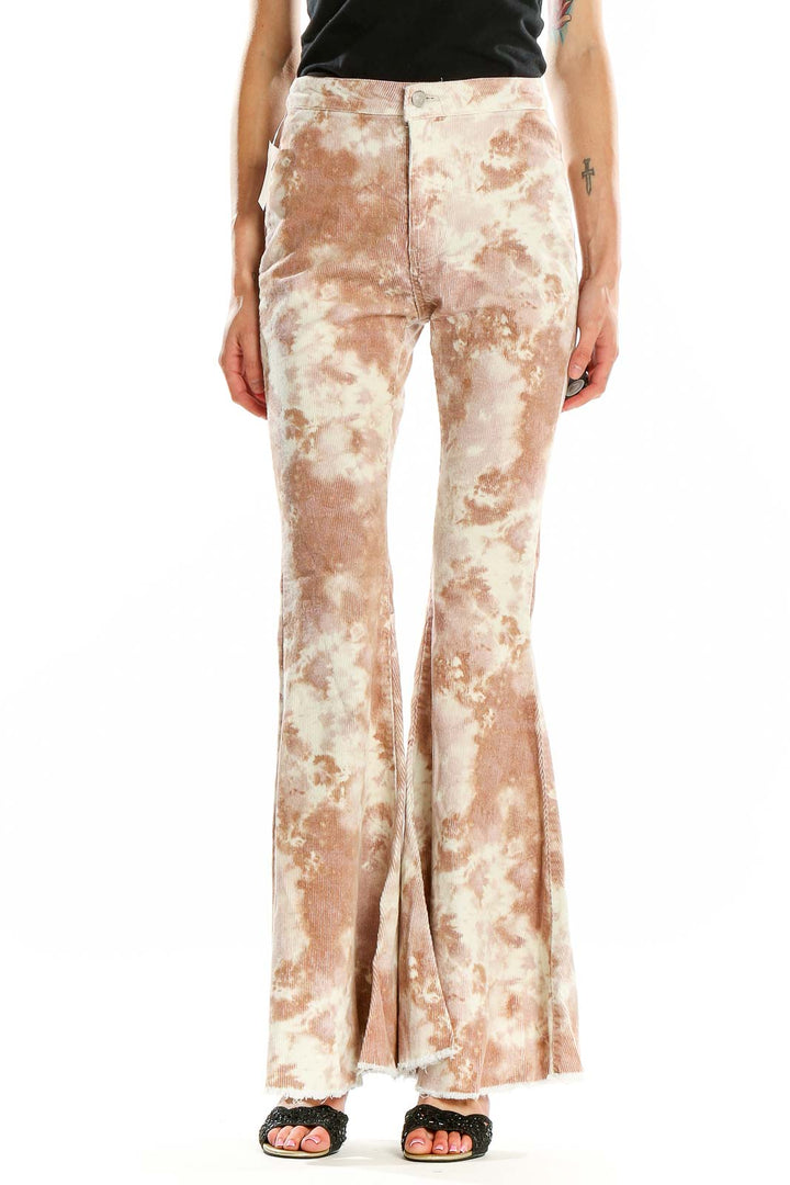 Front view of altar'd state beige tie-dye flared pants