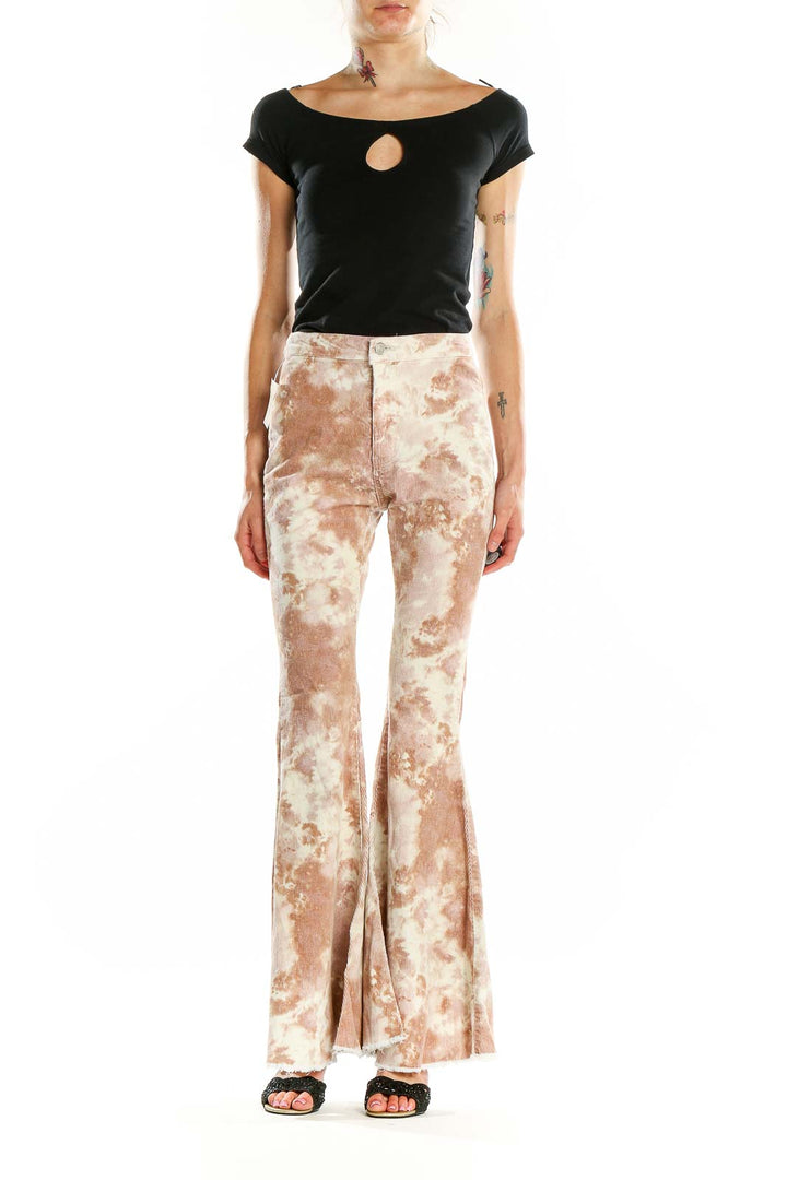 Front view of altar'd state beige tie-dye flared pants