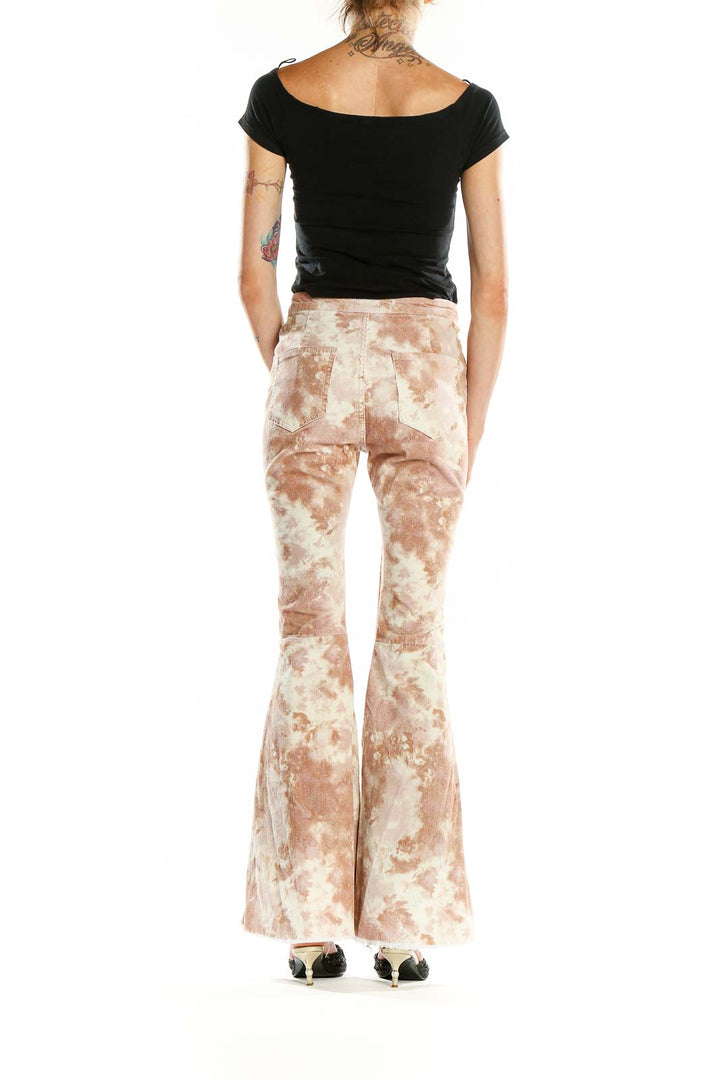 Back view of altar'd state beige tie-dye flared pants