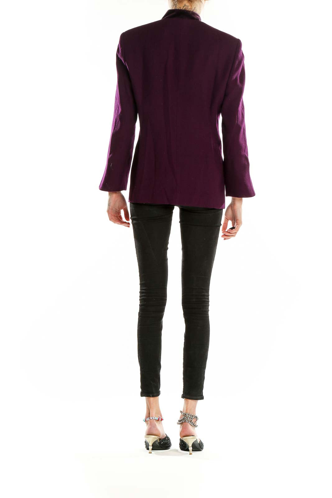 Back view of purple Christian Dior structured coat showing sleek silhouette