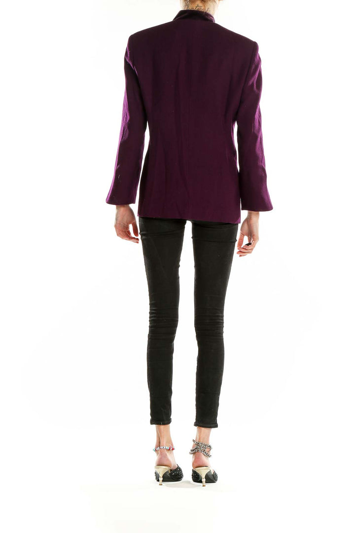Back view of purple Christian Dior structured coat showing sleek silhouette