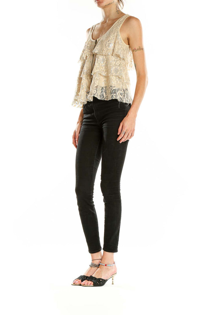 Front view of cream lace tiered tank top with zipper closure