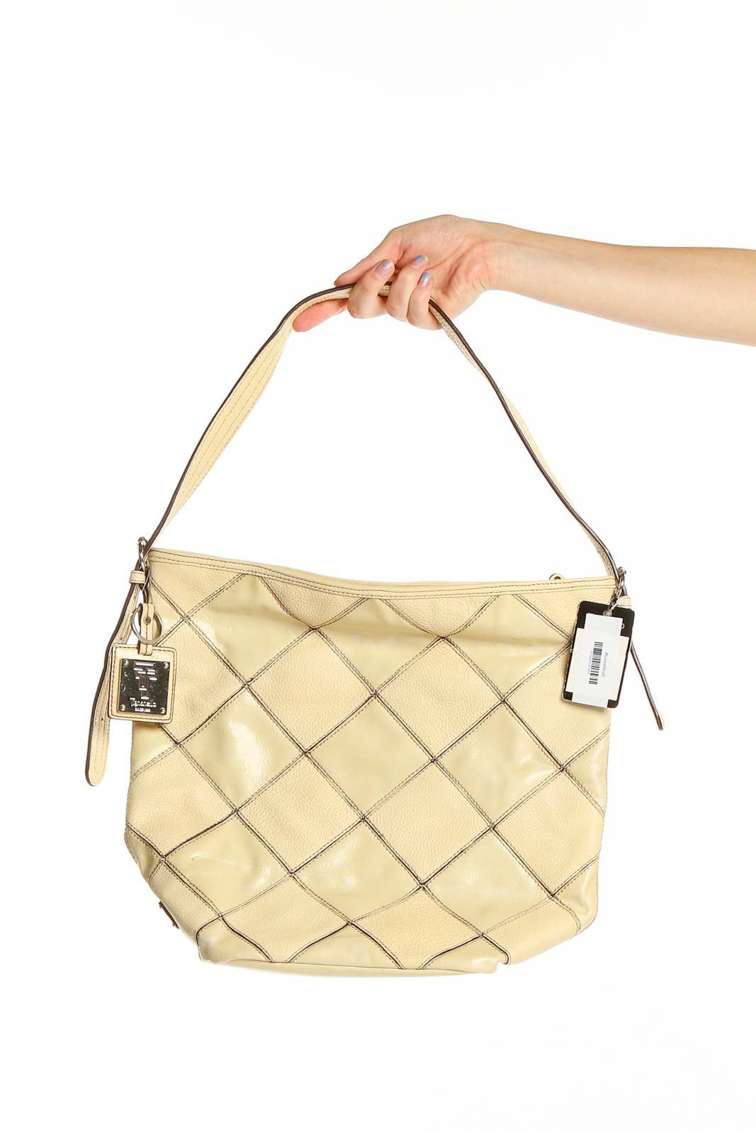 Front view of Tignanello beige quilted leather hobo bag with silver hardware