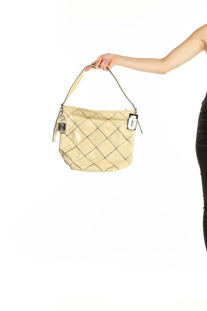 Front view of Tignanello beige quilted leather hobo bag with silver hardware