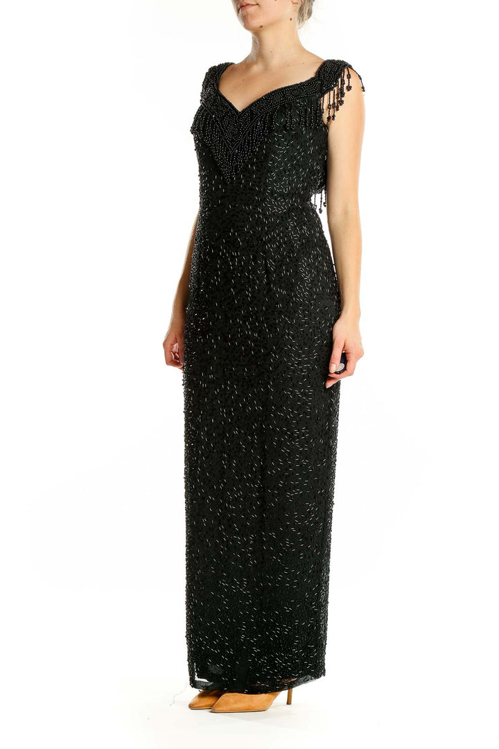 Front view of black beaded maxi dress with sweetheart neckline and cap sleeves