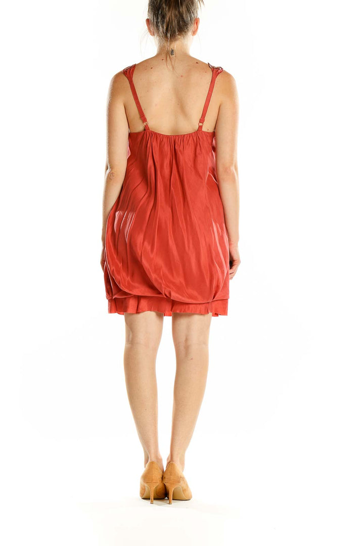 Back view of coral BCBG MaxAzria bubble dress showing adjustable straps