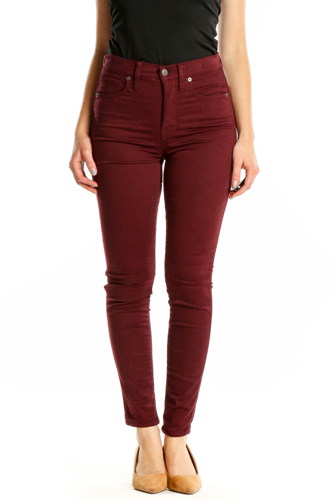 Front view of Madewell burgundy high-waisted skinny pants on model