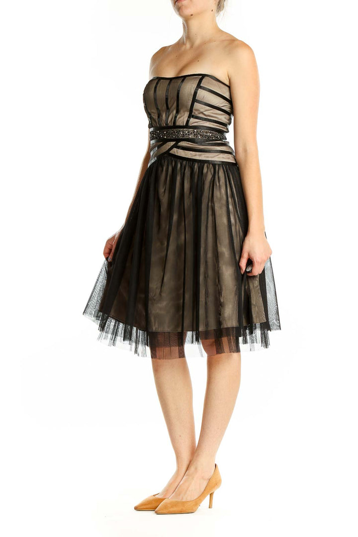 Front view of Max and Cleo black tulle strapless cocktail dress with beige underlay