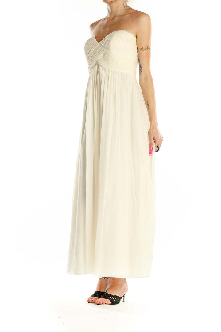 Front view of Donna Morgan ivory strapless maxi dress with empire waist