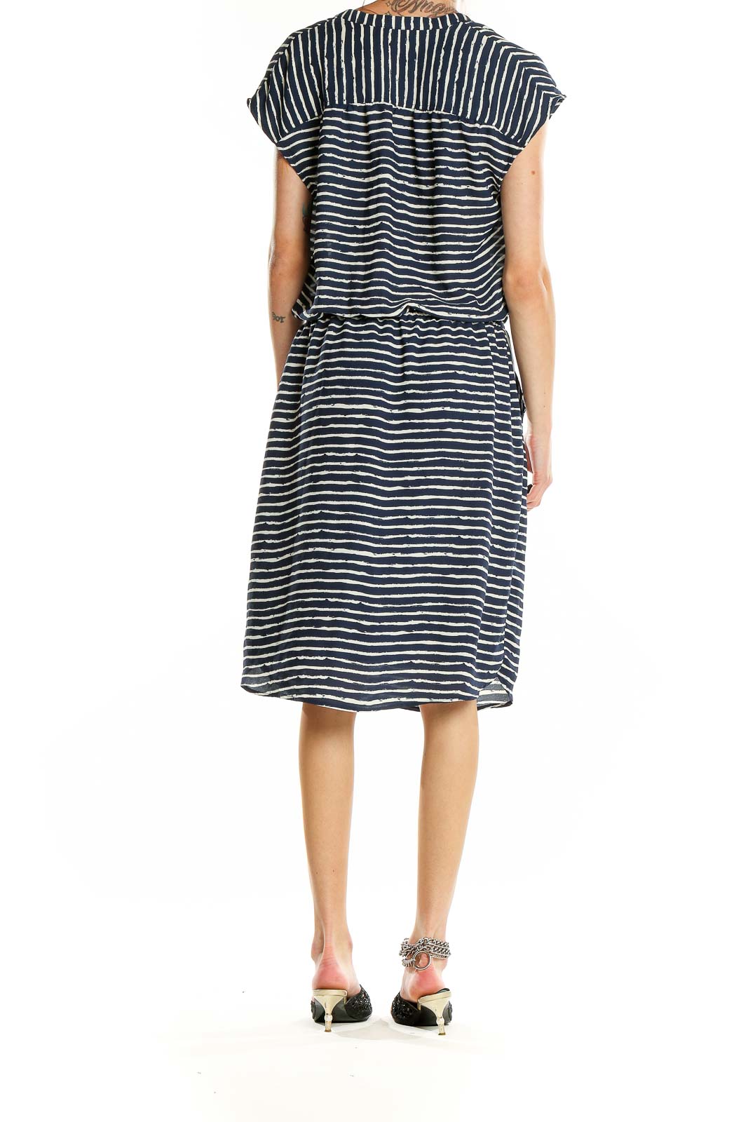 Side view of Banana Republic navy striped V-neck midi dress showing elastic waistband