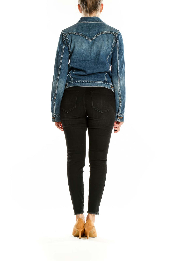 Side view of Earl Jeans blue denim jacket on model with black pants