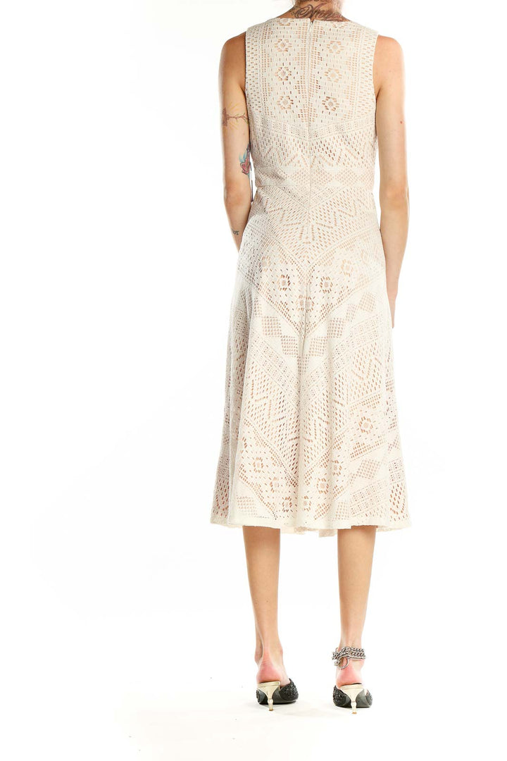 Back view of Vince Camuto cream lace midi dress showing full skirt