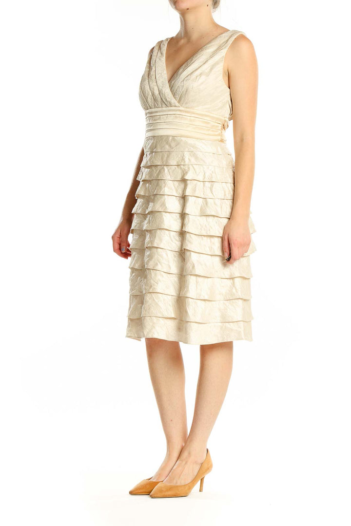 Front view of cream Adrianna Papell cocktail dress with tiered skirt