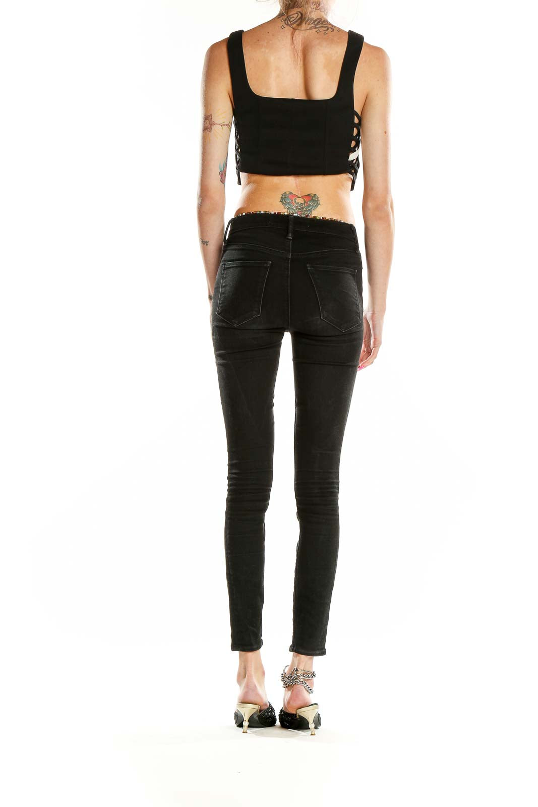 Side view of black bar III cropped tank top showing side lacing detail