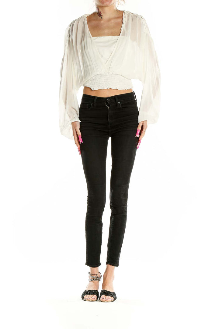 Front view of Anthropologie white sheer cropped peasant blouse with billowing sleeves