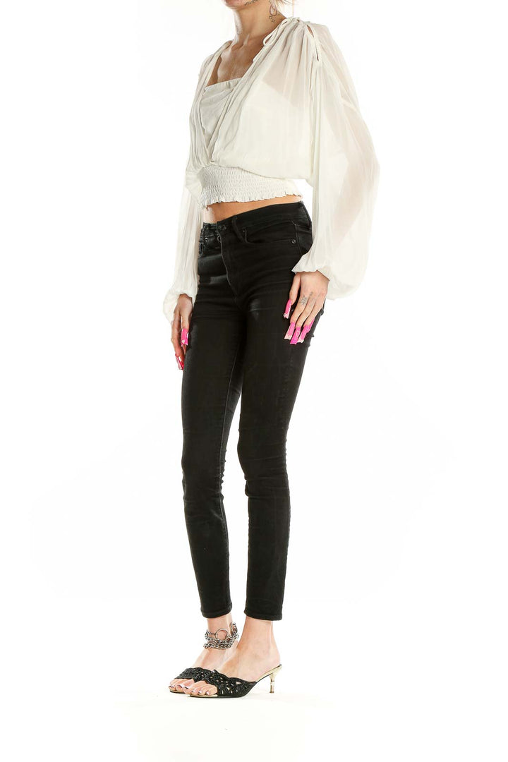 Front view of Anthropologie white sheer cropped peasant blouse with billowing sleeves