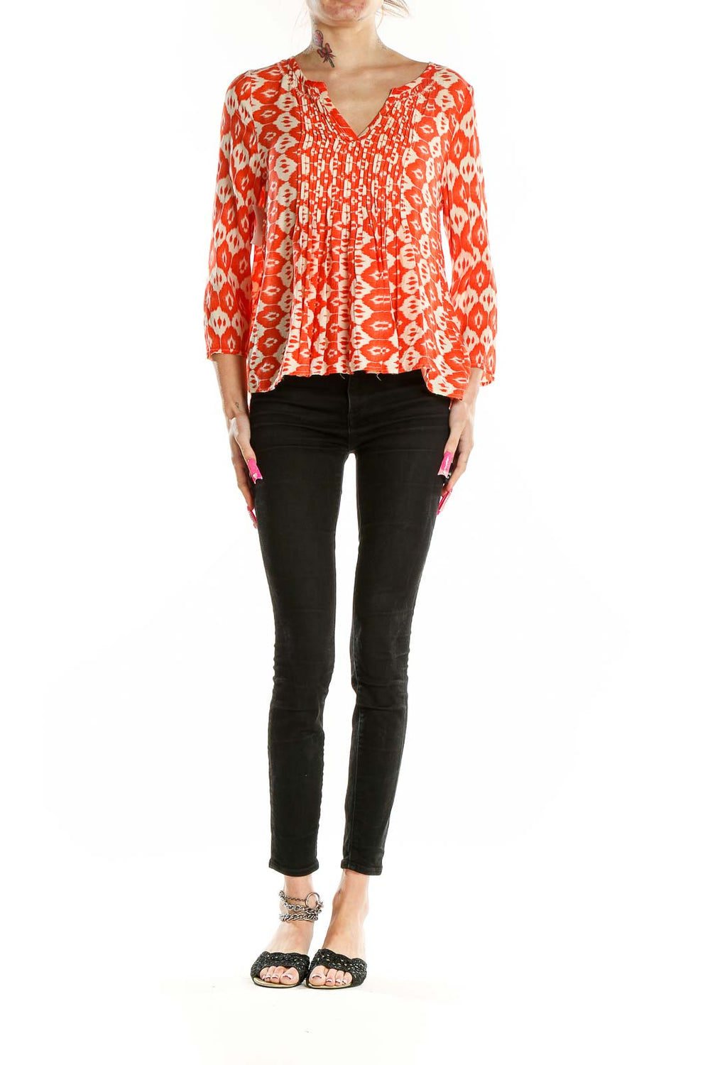 Front view of VANESSAVIRGINIA orange ikat print rayon blouse with V-neck and pintuck pleating
