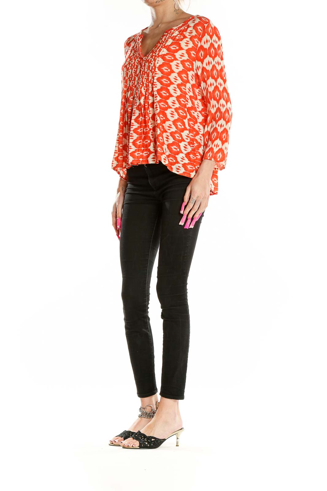 Front view of VANESSAVIRGINIA orange ikat print rayon blouse with V-neck and pintuck pleating