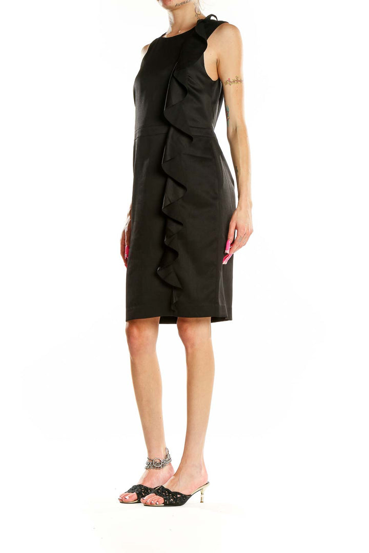 Front view of black Banana Republic sheath dress with side ruffle detail