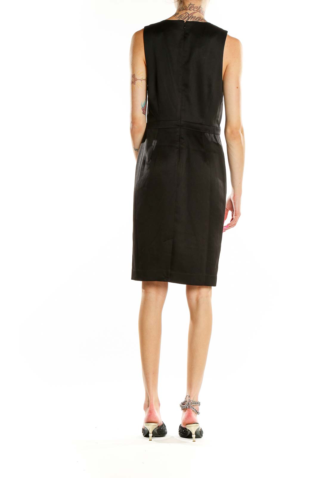 Back view of black Banana Republic sheath dress showing ruffle cascade