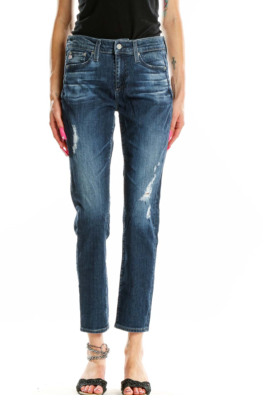 Front view of AG blue distressed slim fit jeans on model