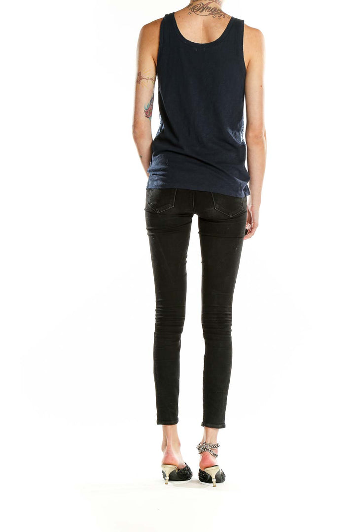 Side view of J.Crew navy sequin tank top on model with black pants