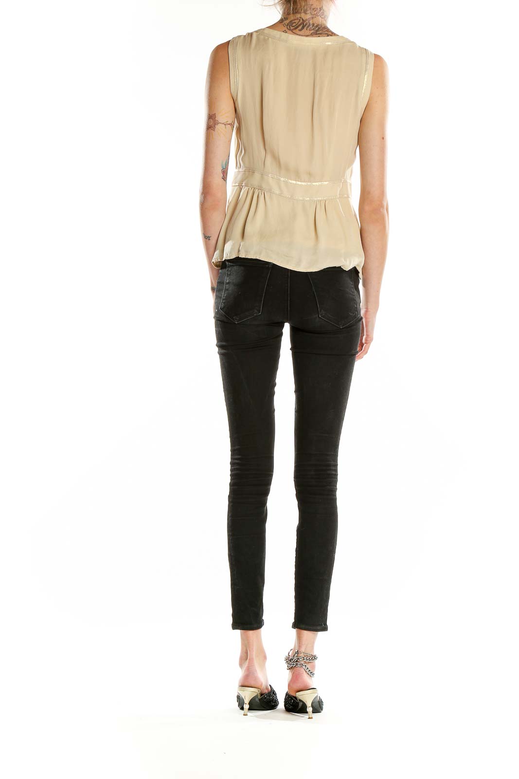 Side view of Nanette Lepore beige metallic silk sleeveless top showing peplum silhouette